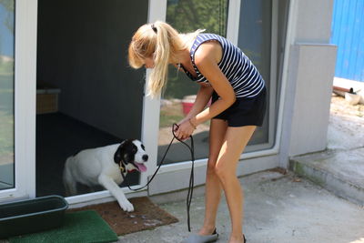 Rear view of woman with dog