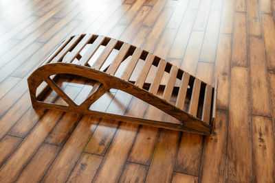 High angle view of wooden chair on hardwood floor