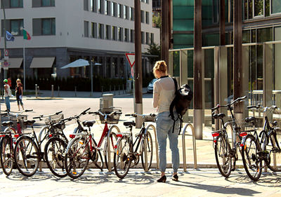 Full length of bicycles parked in city