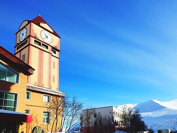 Low angle view of building against blue sky