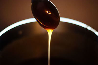 Close-up of wine pouring in glass