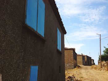 Low angle view of built structure against blue sky