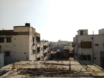 Abandoned buildings against clear sky