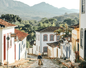 Unidentified tourist walking the streets of tiradentes, minas gerais, brazil