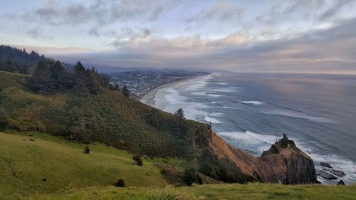 Scenic view of sea against cloudy sky