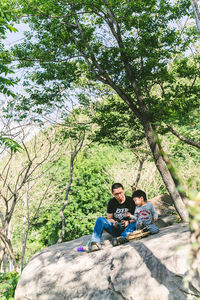 Man sitting on rock