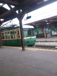 Train at railroad station in city