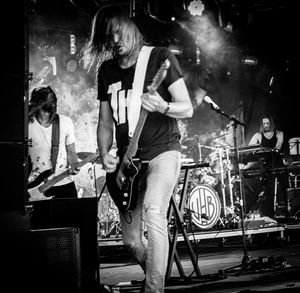 Rear view of woman standing at night