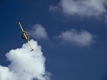 Low angle view of airplane flying in sky