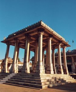 Low angle view of temple against clear blue sky