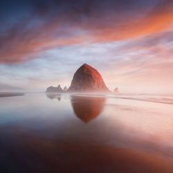 Scenic view of sea against sky during sunset