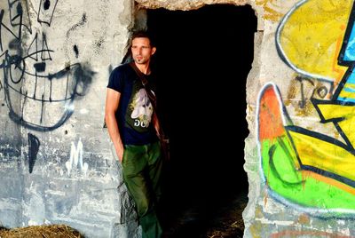 Portrait of a smiling young man standing outdoors