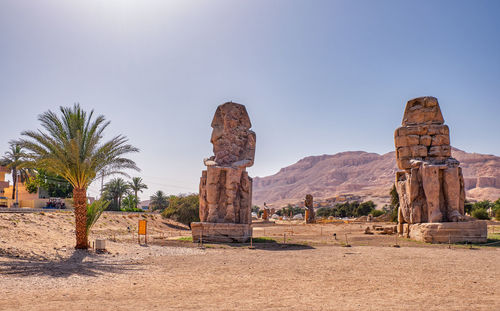 Built structure on landscape against clear sky