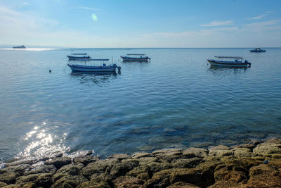 Scenic view of sailboat in sea against sky