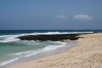 Scenic view of beach against sky