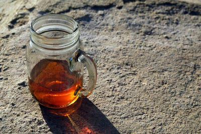 High angle view of beer in glass jar on table