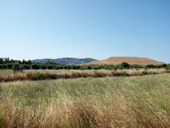 Scenic view of land against clear sky