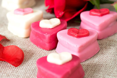 High angle view of heart shape desserts on wooden table