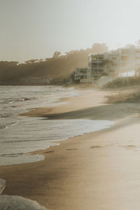 Scenic view of beach against clear sky