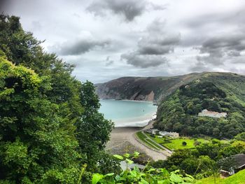 Scenic view of lake against cloudy sky