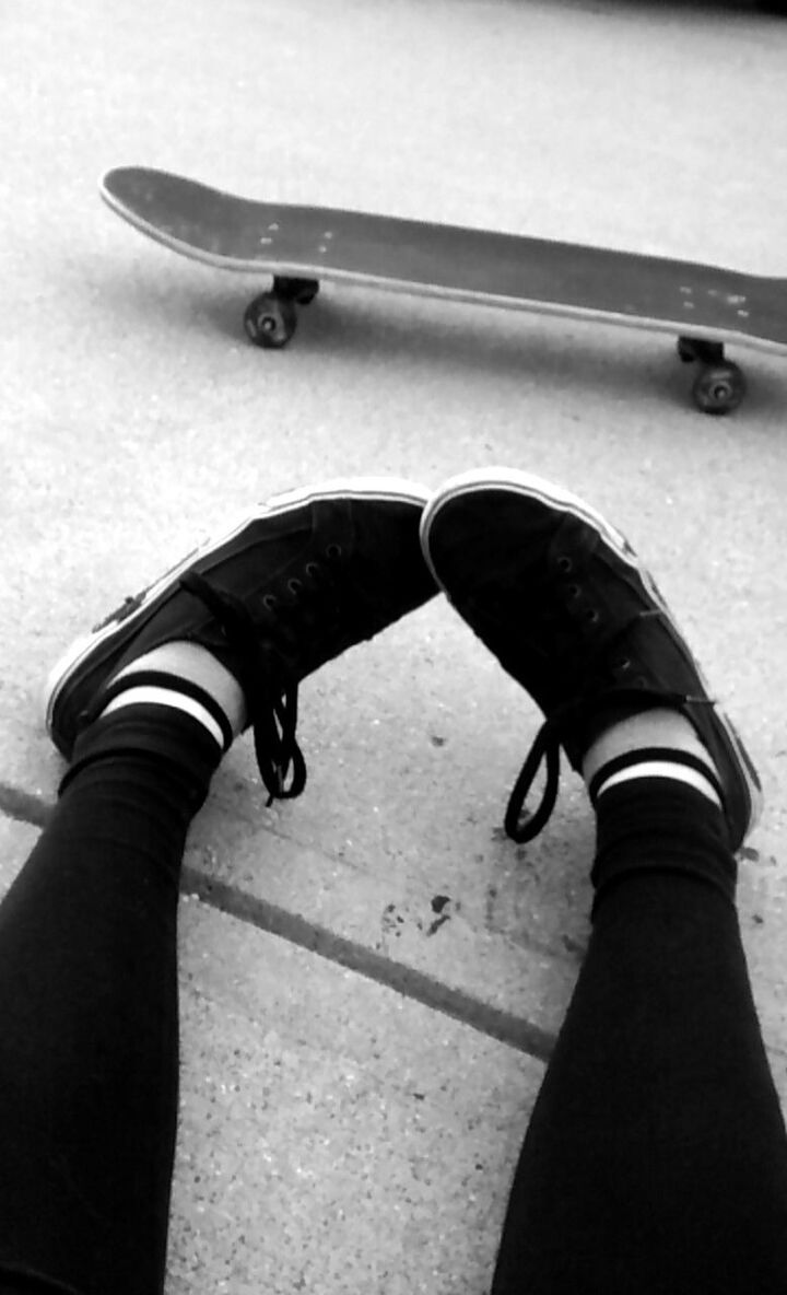 low section, person, part of, shoe, one person, high angle view, footwear, close-up, metal, cropped, personal perspective, shadow, day, sunlight, outdoors, human foot, handle, black color