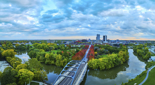 High angle view of cityscape against cloudy sky