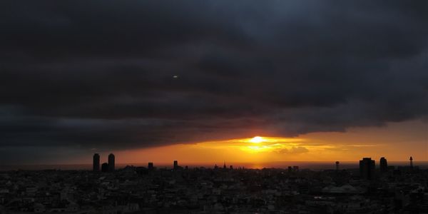 Cityscape against sky during sunset