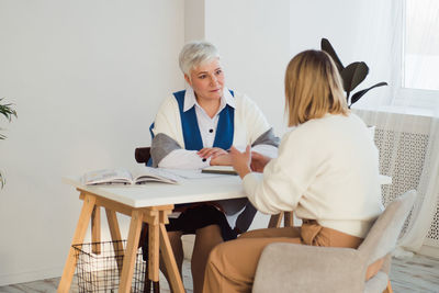 Psychologist consulting patient at clinic