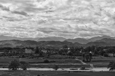 Scenic view of mountains against cloudy sky