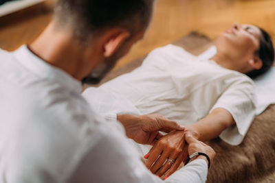Shiatsu hand massage. therapist massaging the heart meridian.
