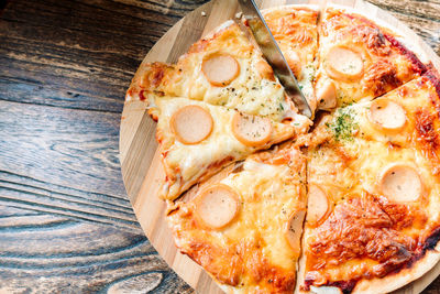 Close-up of pizza served on table