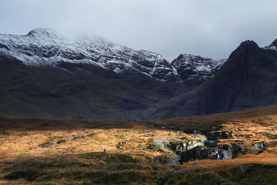 Scenic view of mountains against sky during winter