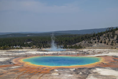 Scenic view of hot spring at yellowstone national park against sky