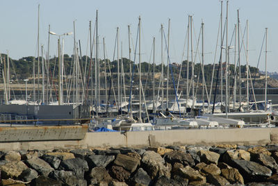 Boats moored at harbor