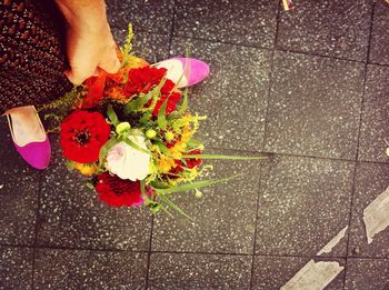 Close-up of woman holding flower