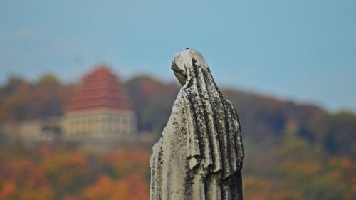 Close-up of statue against sky