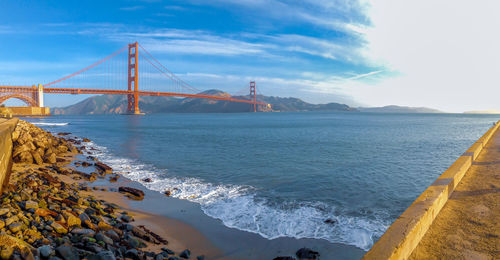 View of suspension bridge over sea