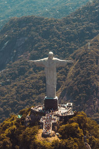 Jesus statue against mountains