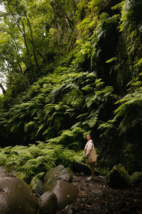 Girl standing in the rainforest, la palma, canary islands, spain