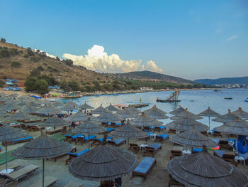 Scenic view of beach against blue sky