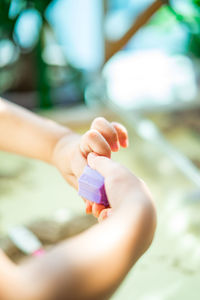 Close-up of woman holding hands