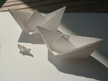 Close-up of paper toy against white background