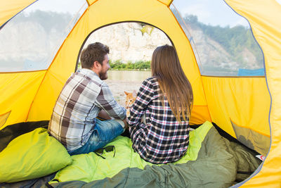 People sitting in tent