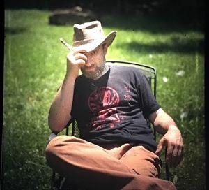 Person sitting on grassy field