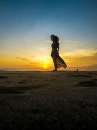 Nice girl with a beautiful sunset pangandaran beach