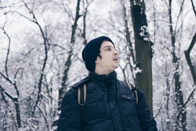 Portrait of young man in snow