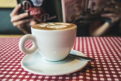 Close-up of coffee cup on table