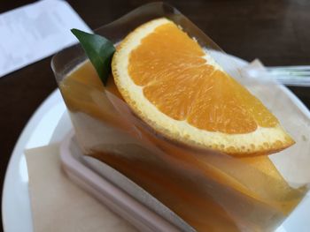 Close-up of orange slice in plate