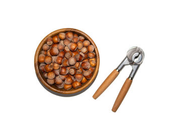 High angle view of coffee beans against white background