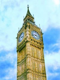 Low angle view of clock tower against cloudy sky